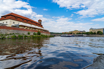Obraz premium Scenic panorama cityscape view of Moldava river boat Prague in Czech Republic.
