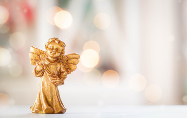 Fototapeta premium golden Christmas Angel, white Background with Lights