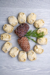 pine nuts with manti around, vertical photo. Top view