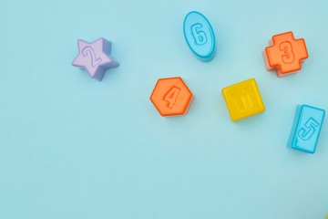 Top view on children's toys on a blue background. Children's toys on the table. concept for advertising toys for children. Copy space. children's toy.