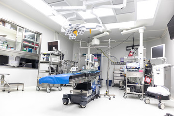 Technologically modern operating room with advanced equipment and medical devices.