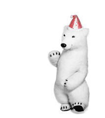 Fototapeta premium Polar bear toy in red cap waving his hand in greeting. Polar bear isolated on white background