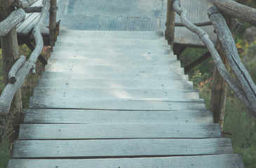 Fototapeta na wymiar wooden stair in the nature
