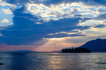 Crepuscular rays over the sea.