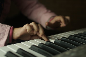 Fototapeta premium children's hands are playing the piano