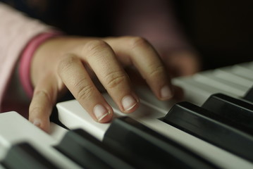 Fototapeta premium children's hand are playing the piano