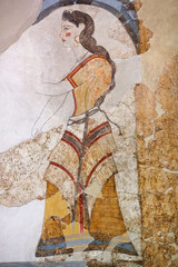 Wall painting of the House of the Ladies depicting a woman from Akrotiri Minoan Settlement on Santorini island, Greece