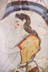 Wall painting of the ancient House of the Ladies depicting a female figure from Minoan Settlement of Akrotiri, located on the Santorini island, Cyclades, Greece