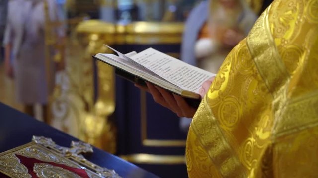 Priest praying in church. Christianity ceremony