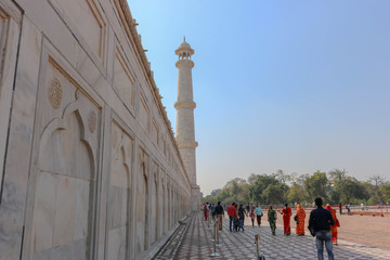 Decorated marble wall leading to one of the minaret of the Taj Mahal. Taj Mahal is an ivory-white...