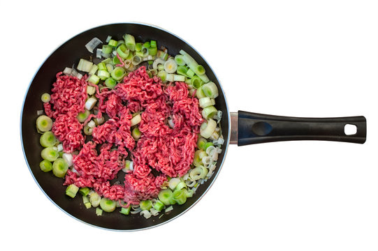 ground beef in a frying pan isolated