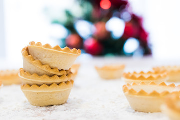 sweets and cakes with christmas tree background