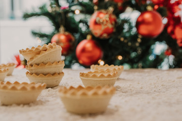 sweets and cakes with christmas tree background