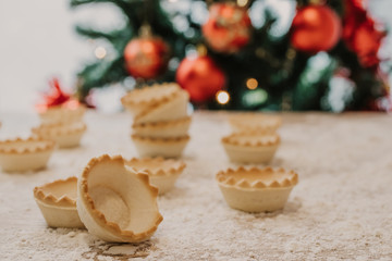 sweets and cakes with christmas tree background