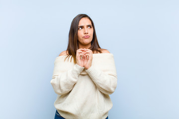 young pretty woman scheming and conspiring, thinking devious tricks and cheats, cunning and...