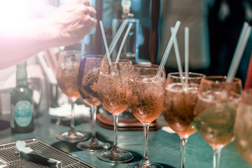 Bartender making cocktails at the bar, alcoholic drinks  