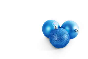 Three blue Christmas balls isolated on white