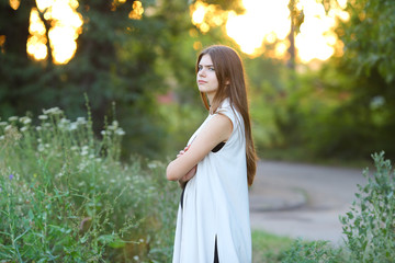 young girl on nature shows emotions