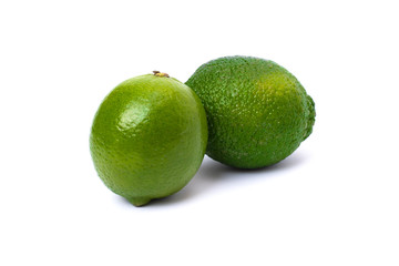 Lime green on a white background. Whole and halves limes isolated on white background. Full depth of field.