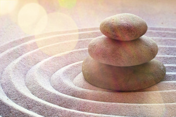 zen garden meditation stone background with stones and lines in sand for relaxation balance and...