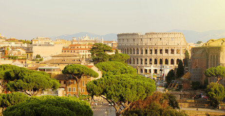 Fototapeta na wymiar Rome cityscape skyline with landmarks of the Ancient Rome: Coliseum and Roman Forum famous travel destinations of Italy.