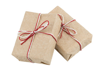 From kraft paper two gifts tied with a red and white rope and a bow. Isolate on a white background.