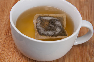 Cup of green tea with teabag