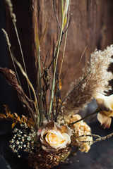 Beautiful autumn bouquet of mixed flowers with dry branches. The work of the florist. Beautiful bouquet. Flower delivery
