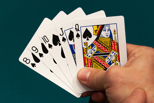 five different play cards in a hand