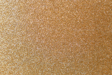 Golden glitter texture. Christmas abstract background. Abstract Bright gold shiny background. Bright halftone pattern. Light paper texture for luxury elegant backdrop design wallpaper or template