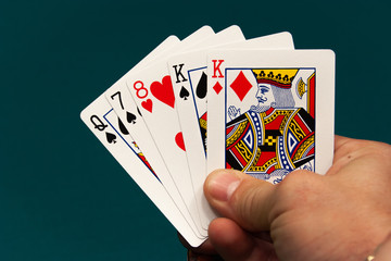 five different play cards in a hand