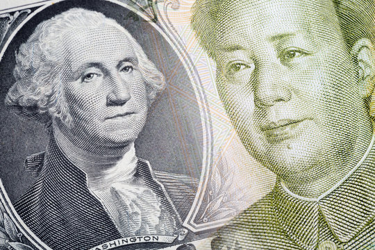 Combined image of The 1 Yuan chinese currency and the 1 american dollar banknotes. Finance concept.