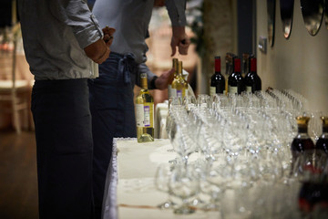 Waiters spill wine during a furchet