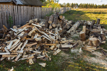 chopping firewood, preparing for winter