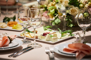 A luxurious covered table for the holiday in an expensive restaurant.