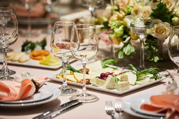 A luxurious covered table for the holiday in an expensive restaurant.