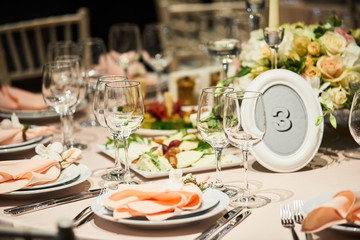 A luxurious covered table for the holiday in an expensive restaurant.