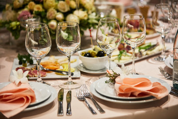 A luxurious covered table for the holiday in an expensive restaurant.