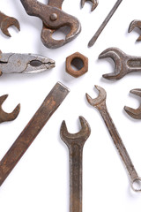 Old rusty stainless steel crescent wrench isolated on white top view