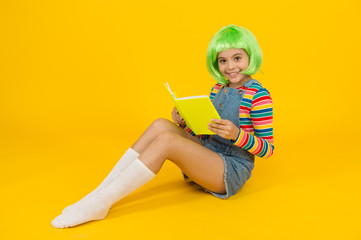 Relax and read book. Adorable small child read book yellow background. Cute little girl enjoy reading. You cant buy happiness but you can buy book. Book store. Library. Bibliopole