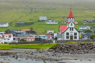 Lutheran Church With Red Roof in Sandavagur village, Located On The Faroe Islands, Denmark.