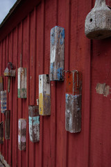 Red boat house wall in Rockport harbor - 300442133