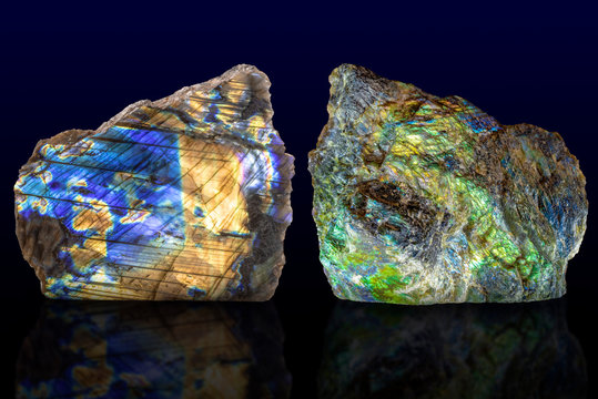 Polished side and raw side labradorite (labrador) gemstone on dark background