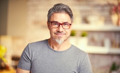 Portrait of happy older white man wearing eyeglasses.