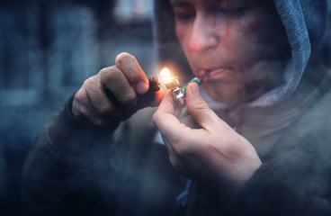 addicted man smokes marijuana