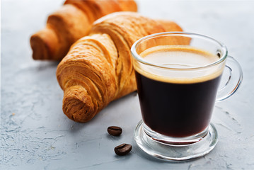 Coffee drink with fresh croissants