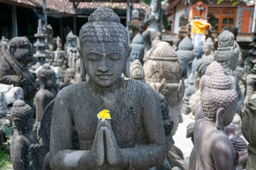 Buddhist statue at stonemasons workshop Bali Indonesia