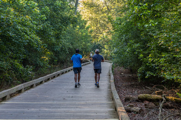 ALPHARETTA, GEORGIA -August 27, 2017: The Big Creek Greenway is over 20 miles of paved and board fitness trails spanning two counties north of Atlanta through lush green wetlands.