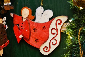 Angel-shaped holiday ornaments on a Christmas tree