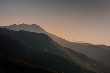 Mountains Landscape. Beautiful Dramatic Mountain peaks at sunset.